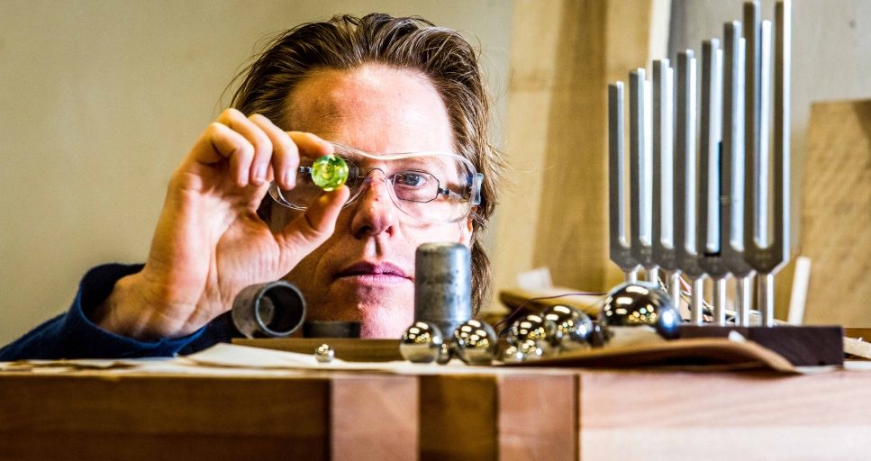 A professor with various tools.