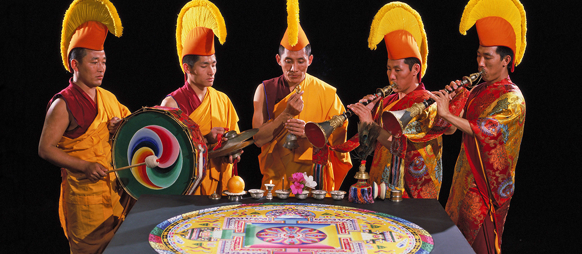 tibetan mystic arts web monks with traditional instruments around sand mandala
