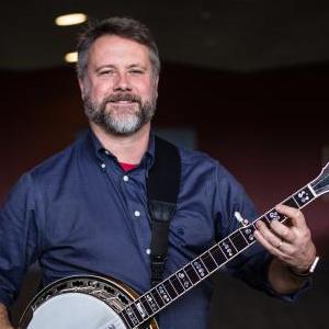 Jonathan T. King playing banjo