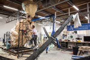 Brent Skidmore working on a giant sculpture in STEAM Studio