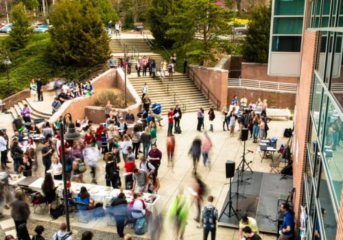 Students gathering in outdoor space on campus