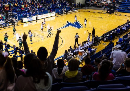 kids cheer at a basketball game