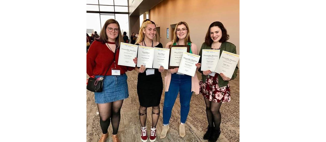: From left: Brailey Sheridan, Emma Jordan, Sarah Shadburne and Taylor Sexton hold The Blue Banner’s awards.