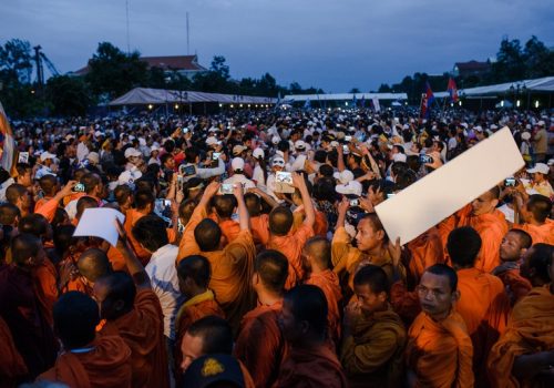 Movie freeze-frame of a large crowd.