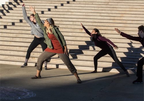 students dancing on library steps