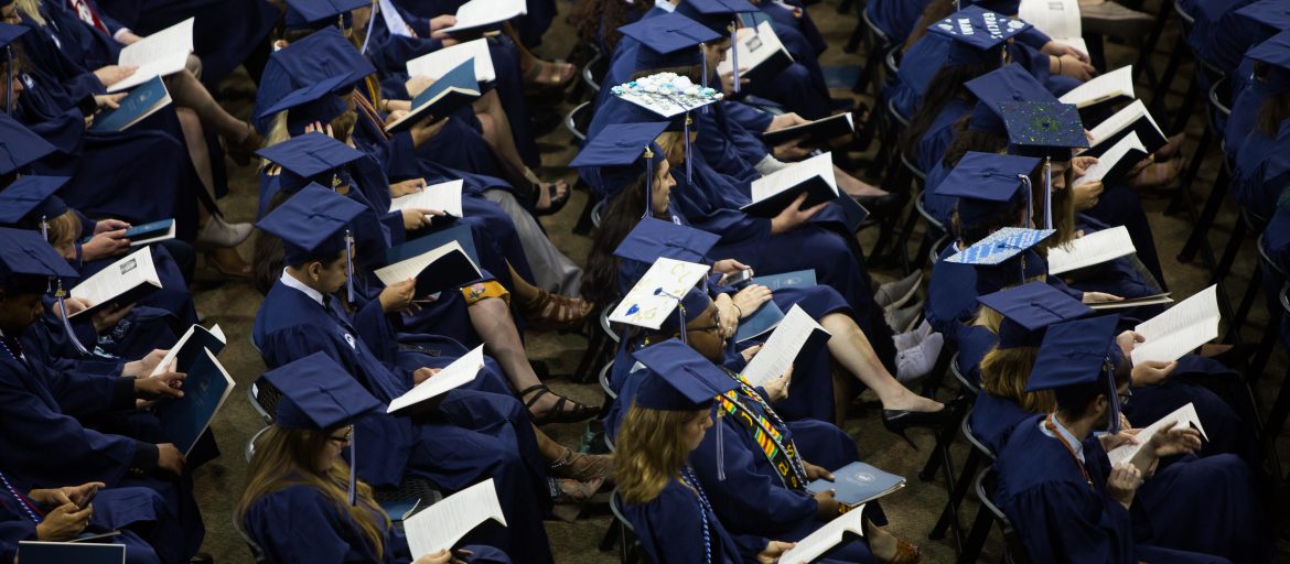 Students sitting during 2019 commencement.