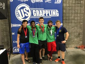 students pose with award medals