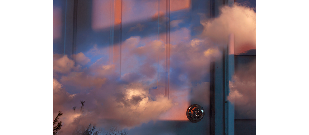 Guibald, Celine – Transient web photo has sky superimposed over view of door and wall