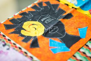 Quilt square shows image of a girl