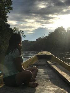 a woman on a boat in a river