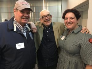 three people smile
