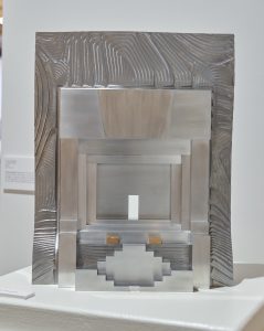 Gleaming metal rectangular sculpture