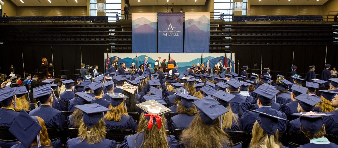 students in caps and gowns at commencement ceremony
