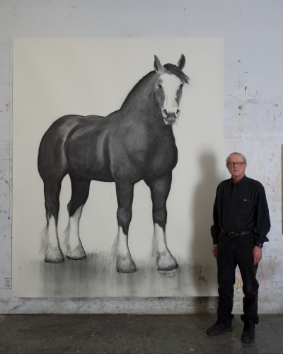 William Beckman posed next to his large drawing of a Clydesdale horse