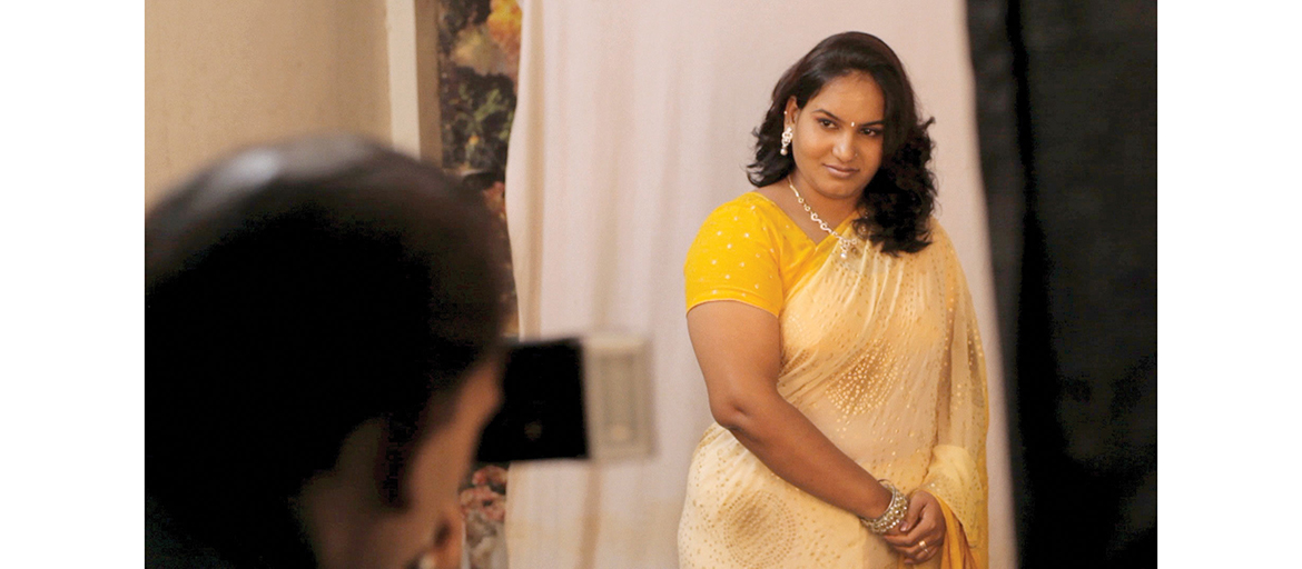 asuitablegirl_image_02 Image from the film shows woman in traditional Indian sari with a man looking at her