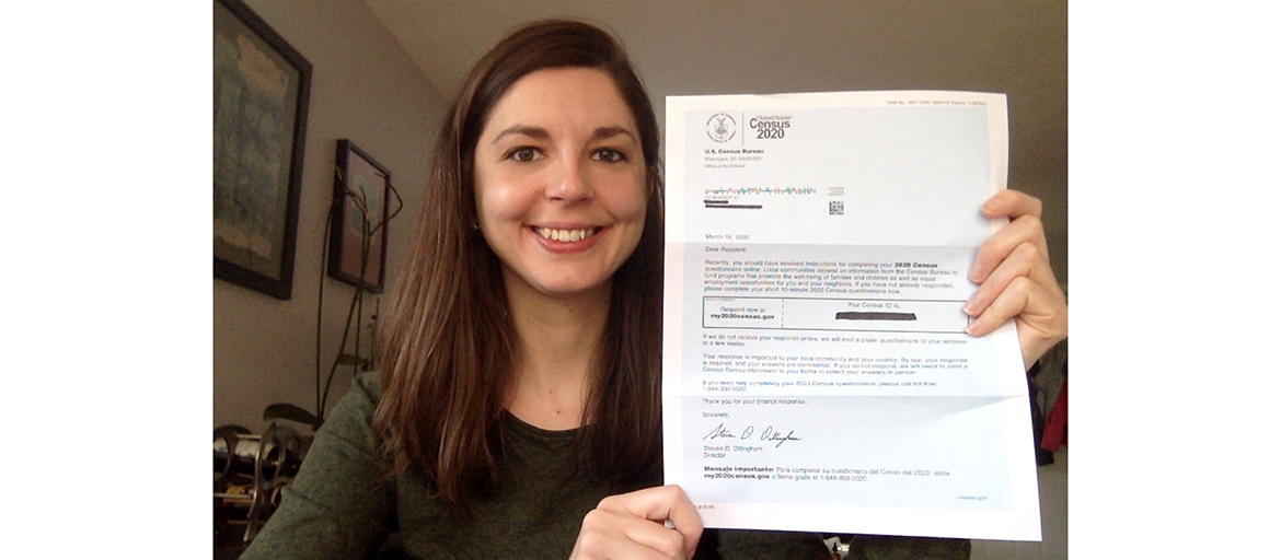 Ashley Moraguez holds up a letter sent to households by the census