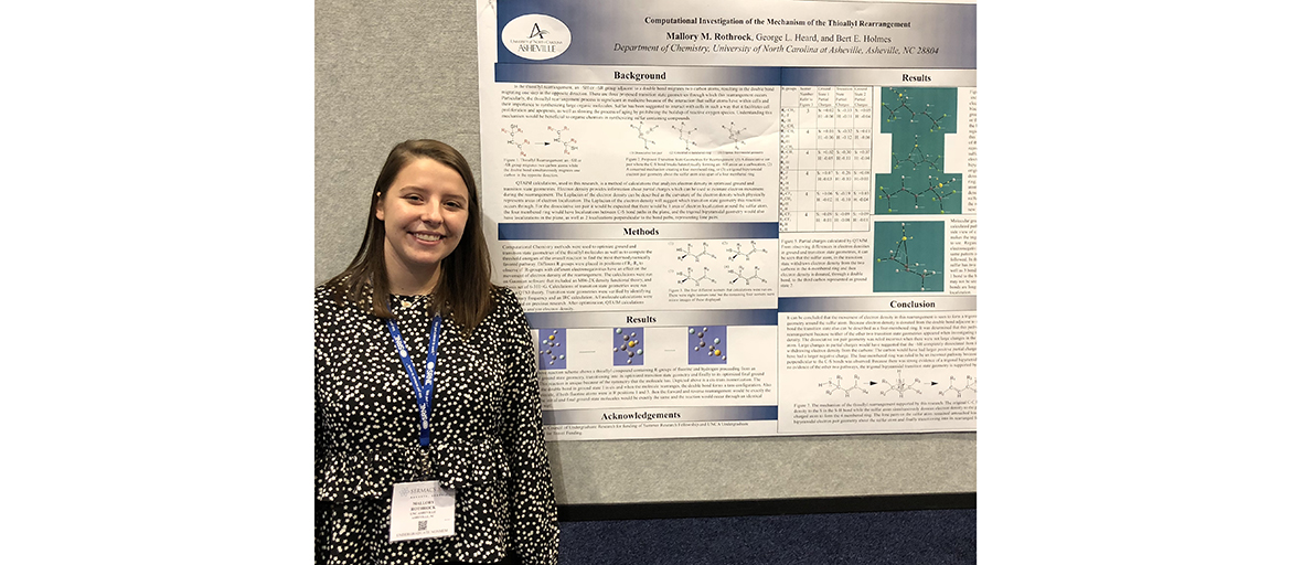 Mallory Rothrock stands with her presentation poster