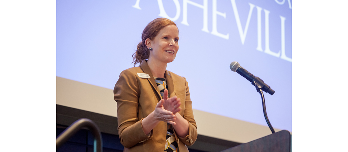 Laura Herndon at a podium