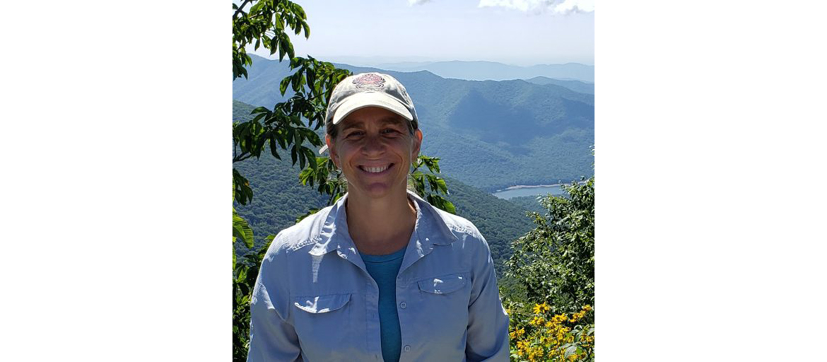 Jennifer Rhode Ward stands with Blue Ridge Mountains in the background
