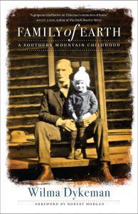 Book cover of "Family of Earth" has photo of older man and young child and endorsement quote from Wiley Cash