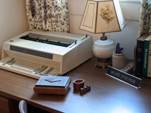 desk has Dykeman's typewriter and other items