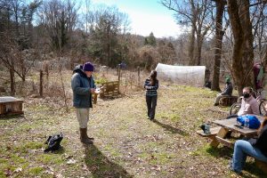 students and professor in garden