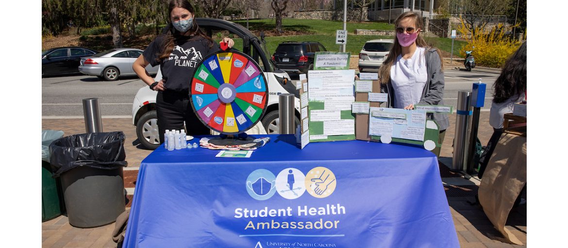 students a student health ambassador table with games