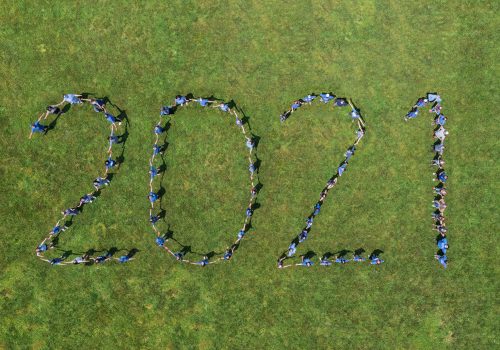 Aerial photo of 2021 spelled out with people