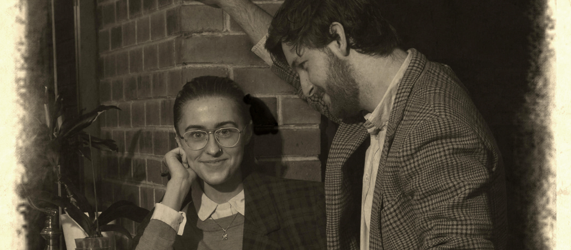 12th Old timey photograph of a man staring at a woman, and the woman staring at the camera