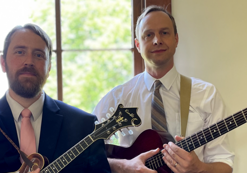 Two men with string instruments