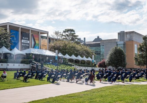 UNCA Graduates gather on the quad in front of Ramsey Library for Commencement Ceremony
