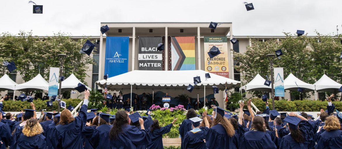 Students throwing their caps in the air during commencement