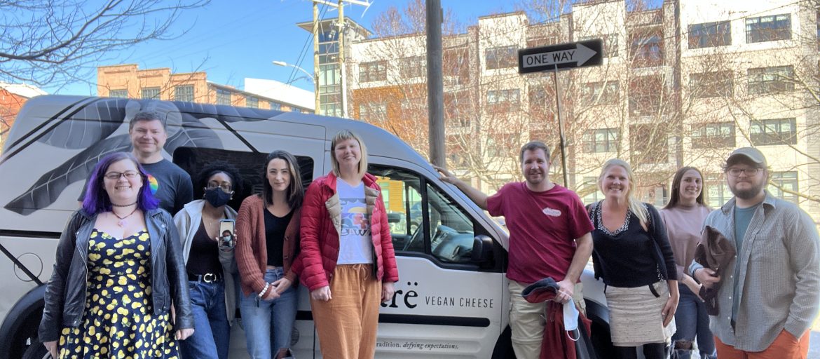 Students leaning on a van