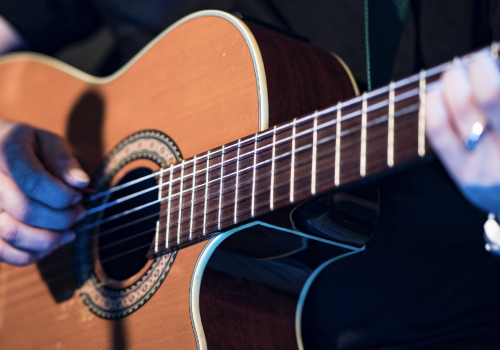 Close up of a guitar being played