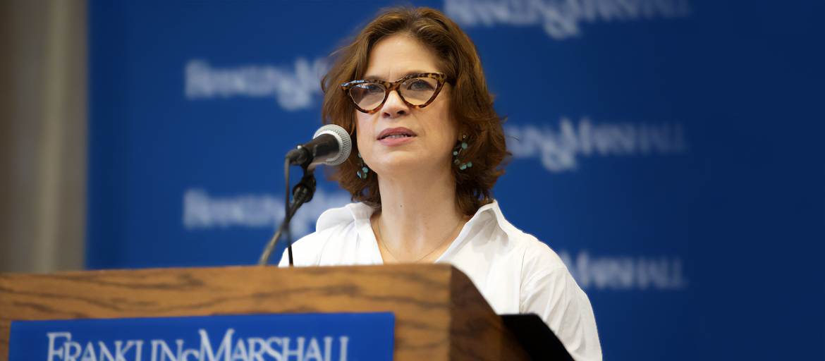 castor Alexis Castor speaking at podium