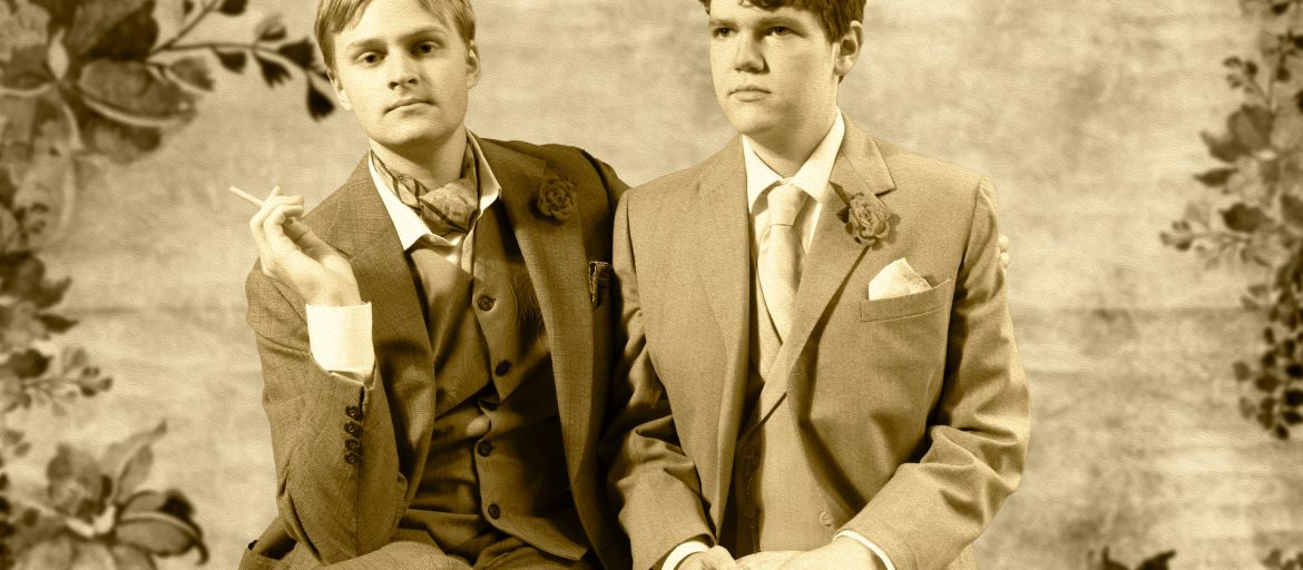 Students Ewan Marshall and Bryce Long portray Oscar Wilde and Lord Alfred Douglas in a historically recreated photograph.