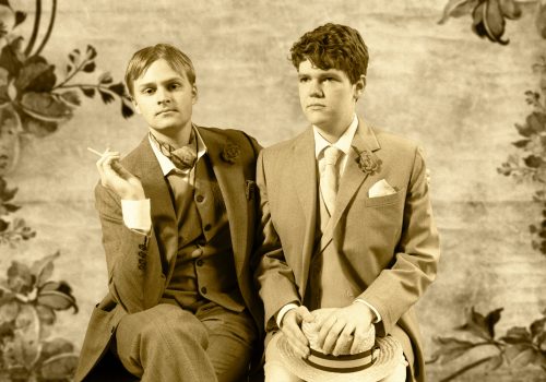 Students Ewan Marshall and Bryce Long portray Oscar Wilde and Lord Alfred Douglas in a historically recreated photograph.