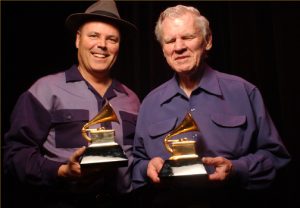 David Holt (left) and Doc Watson (right) with their Grammy awards. Photo courtesy of David Holt.