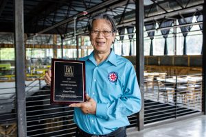 Oscar Wong receiving the Brewer's Association 2020 Recognition Award. Photo courtesy of Highland Brewing.