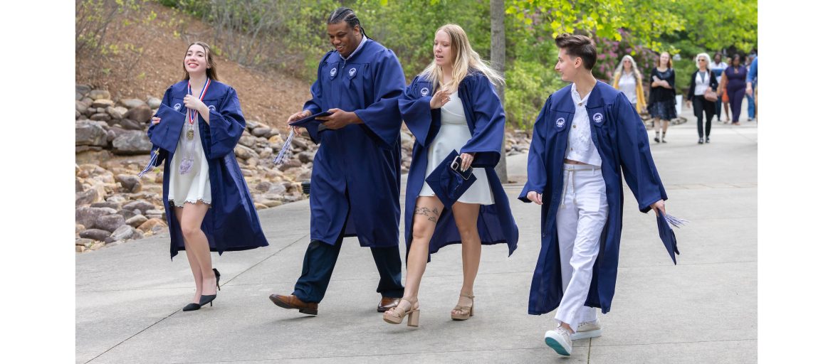 A photo of students walking to Commencement