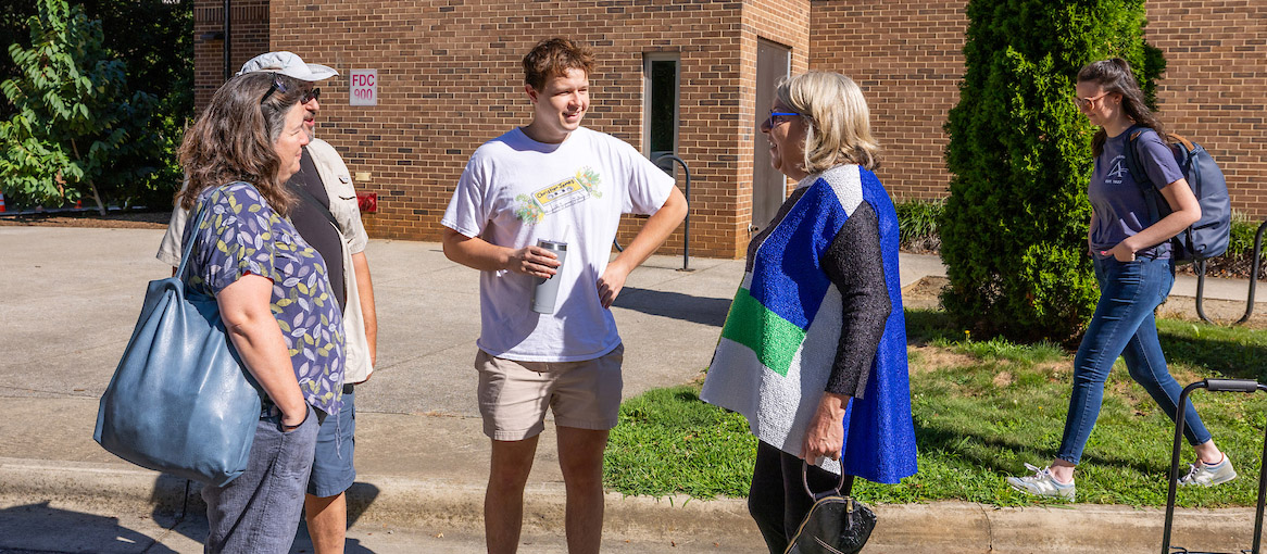 a photo of the chancellor speaking with students