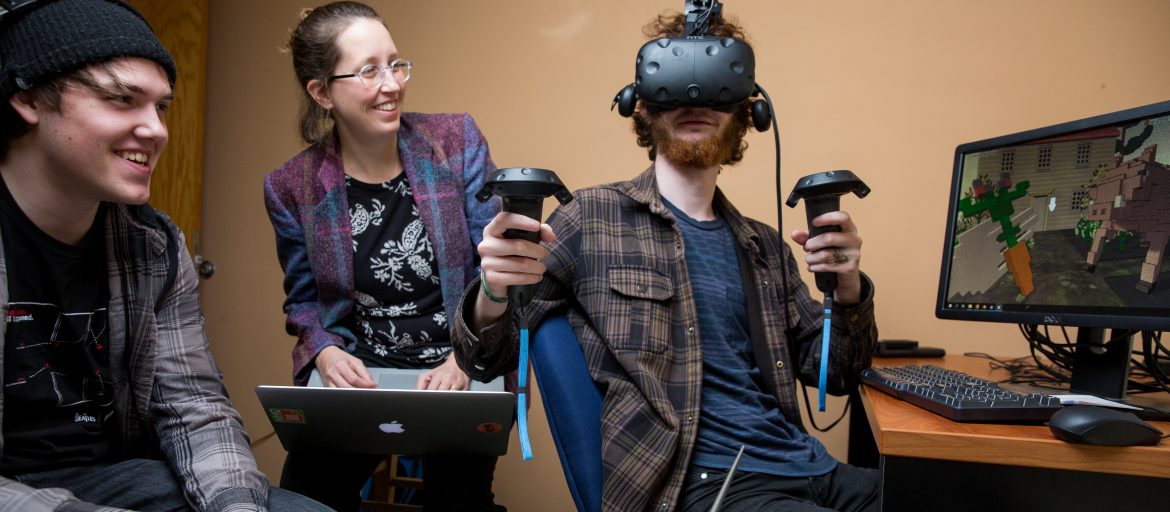 Victoria Bradbury working with student wearing VR headset