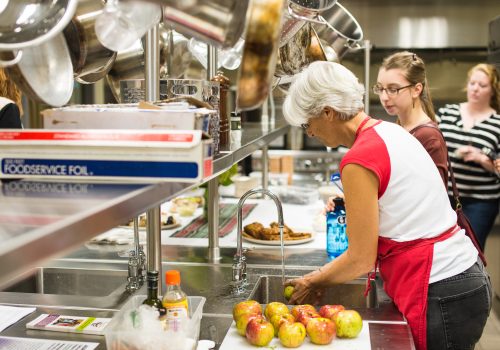 Students being taught in one of the learning kitchens at UNC Asheville's Sherill Center.