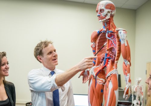 Jason Wingert teaching with a skeleton model