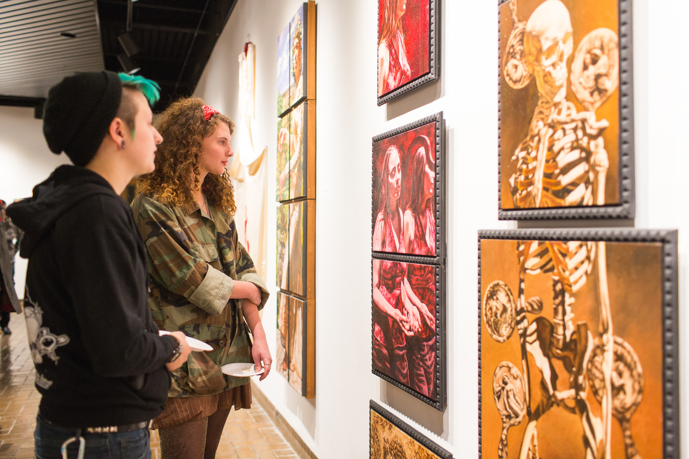 students looking at art in owen hall