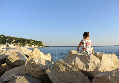 Student looking at the coast of Slovenia