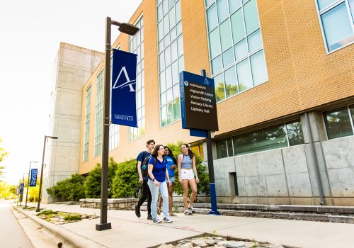 Students walking by Zeis Hall