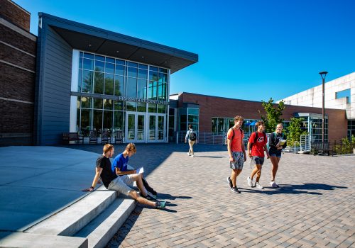 Students walking in front of Highsmith Student Union