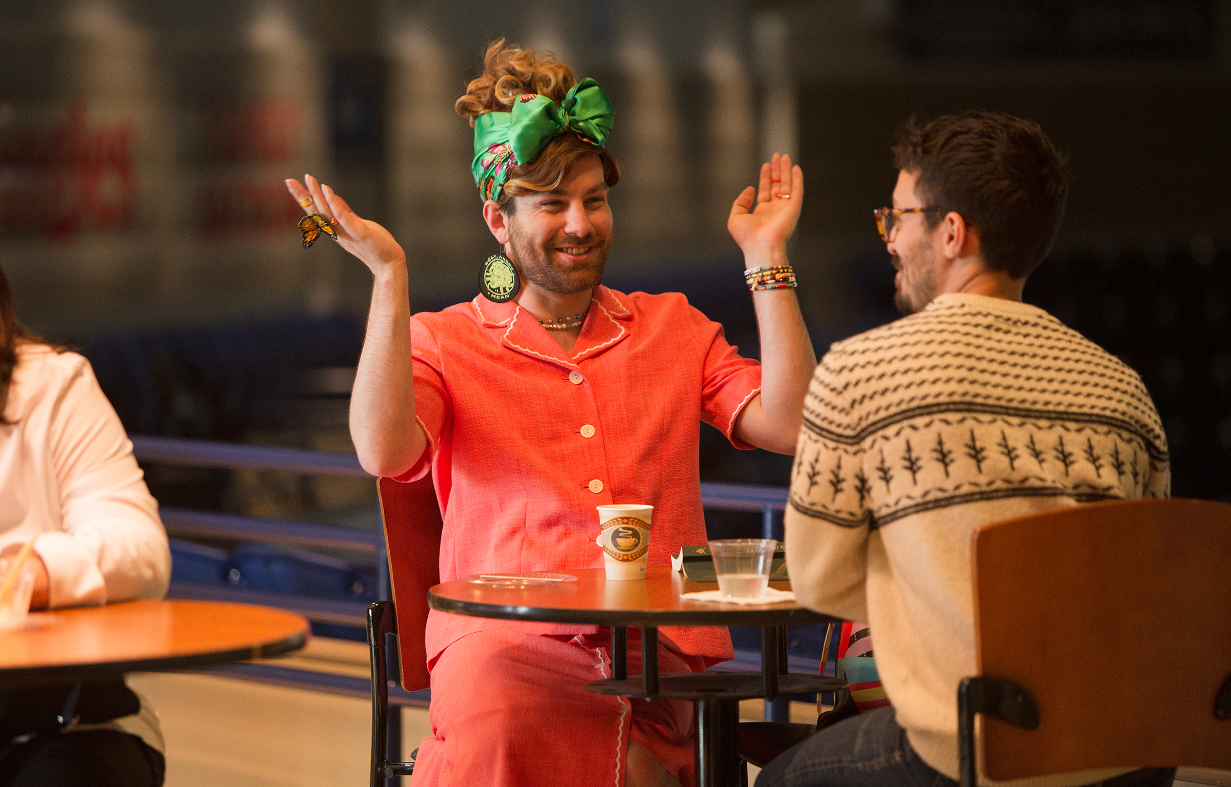 Students in masks talking on campus