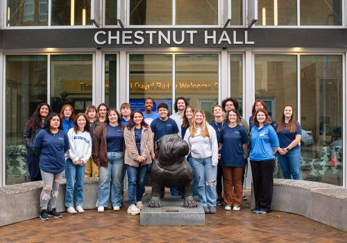 Group photo of student ambassadors in front of Chestnut Hall